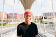 © ADDICTIVE STOCK - Handsome black boy standing on the street