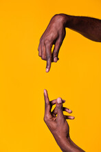 Opposed Hands Of Black Man Pointing At Each Other