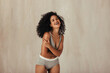 © Jacob Lund - Smiling black female model posing in her natural body