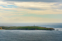Punta Da Frouxeira Lighthouse, Promontory On The Spanish Atlantic Coast.