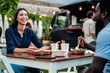 © Alessandro Biascioli - Happy multiracial friends having fun eating in a street food truck