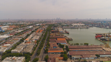 Wall Mural - aerial view cargo and passenger seaport with ships and crane Tanjung Perak, surabaya, indonesia. docks for the repair and parking of ships, cargo port and container terminal. ship in industrial port