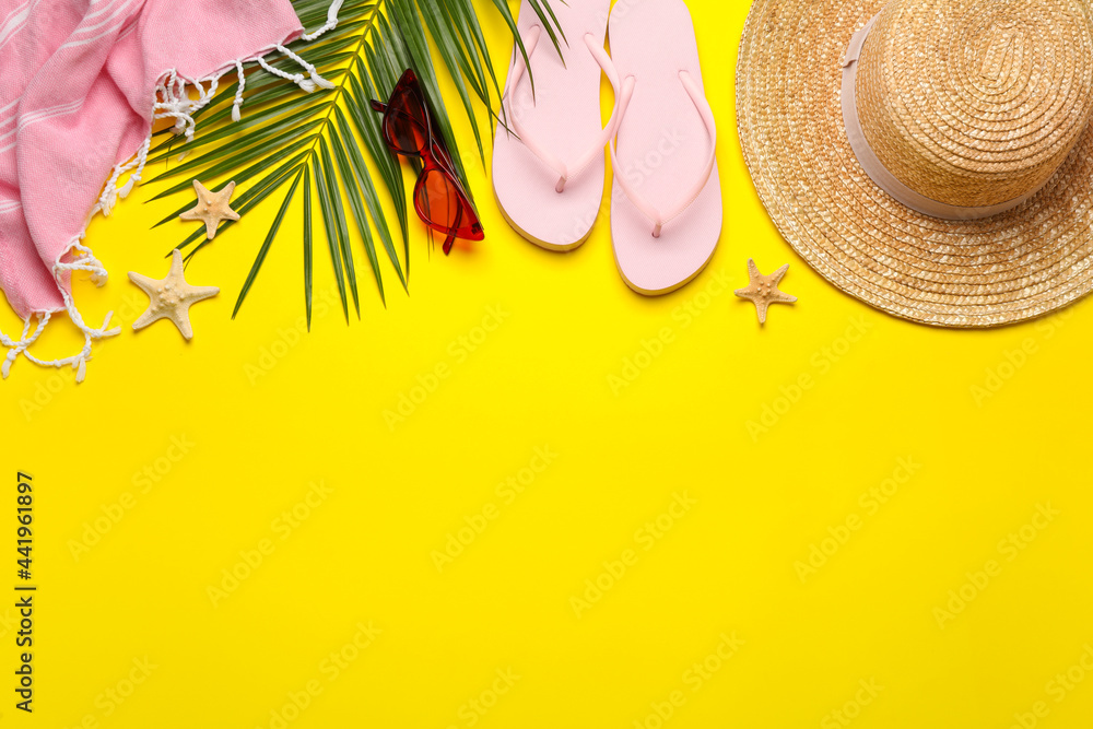 Flat lay composition with different beach objects on yellow background, space for text - obrazy, fototapety, plakaty 