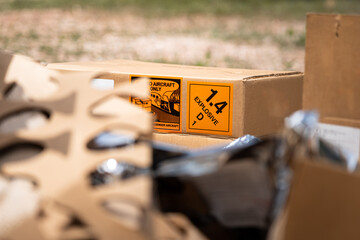 explosive triangle placard sign on the carton box, to demonstrate the dangerous material inside. ind