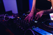 © toxicoz - the hands of a dj girl at the music control panel