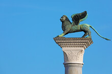 Winged Lion, Symbol Of Venice, On A Tall Column