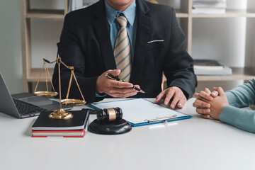 Close-up of businessman lawyer and client sitting at the office negotiating together using document.