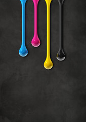 Wall Mural - cmyk ink drops on black concrete background
