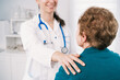 © ADDICTIVE STOCK - Crop physician supporting senior patient during consultation in clinic