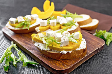 Poster - Bruschetta with pumpkin and arugula on board