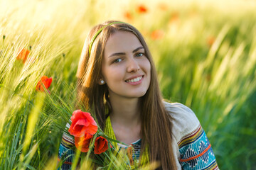 Wall Mural - Nice ukrainian girl with long hair in national embroidered costume