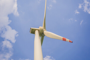 Wind power plant. green meadow with Wind turbines generating electricity