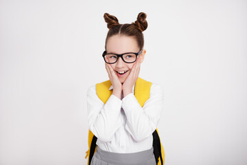 Sticker - portrait of cute surprised girl in school uniform and eyeglasses over white background