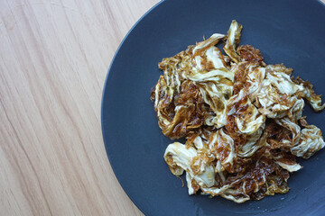 Fried cabbage is often found in street food stall in Indonesia.        