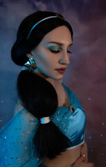 Beautiful princess closeup on the night sky background. Art photo.Jasmine princess cosplay.
