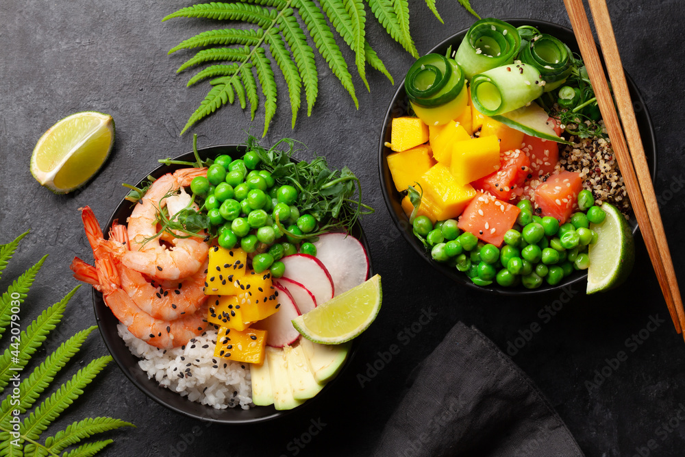 Poke bowls with shrimps, salmon, avocado and mango - obrazy, fototapety, plakaty 