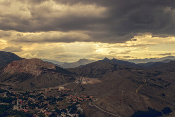 Wall Mural - Sun rays and desert mountains. Landscape in the middle east