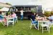 © Alessandro Biascioli - Happy multiracial people having fun eating in a food truck