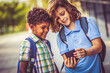 © liderina - Two boys looking at the phone.