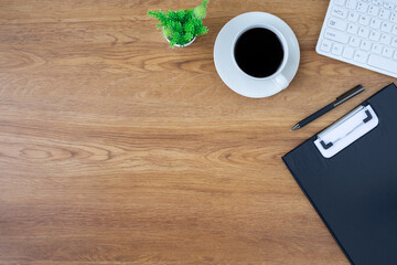 Wall Mural - Workplace in office with Wooden office desk table. Top view from above of keyboard computer. modern creative work of designer. Flat lay with copy space. Business-finance concept.