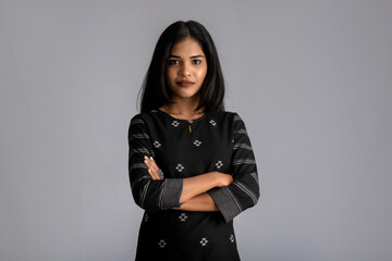 Portrait of a young girl woman posing on gray background