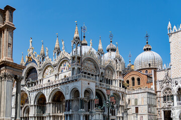 Wall Mural - Basilica di San Marco or St Mark's Basilica, Venice, Italy. Details of the luxury facade. Ornate detail of the landmark of Venice in summer.