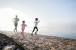 © Odua Images - father and daughter do exercises running outdoor racing each other. Healthy lifestyle of family with child
