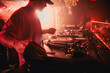 © ADDICTIVE STOCK - DJ mixing music during party in club