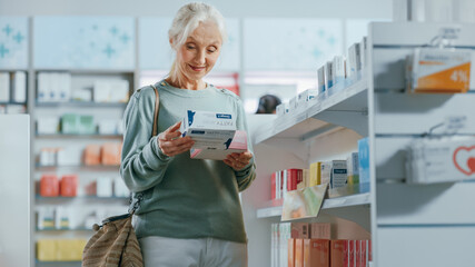 Wall Mural - Pharmacy Drugstore: Portrait of a Beautiful Senior Woman Choosing to Buy Medicine, Drugs, Vitamins. Apothecary Full of Health Care Products, Supplement Bottles, Beauty Packages with Modern Design