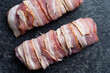 close up of bacon  wrapped pork tenderloin raw uncooked