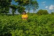© Dip Photography - A young man farmer in a cotton farm examines and observing the field.