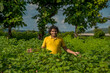© Dip Photography - A young man farmer in a cotton farm examines and observing the field.