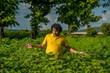© Dip Photography - A young man farmer in a cotton farm examines and observing the field.