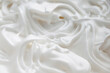 Whipped egg whites white cream. Background with whipped cream close-up with selective focus.