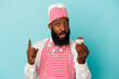 African american ice cream maker man holding an ice cream isolated on blue background having some great idea, concept of creativity.