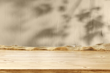 Wall Mural - Wooden desk of free space and wall with shadows 