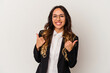 © Asier - Young mexican business woman isolated on white background raising both thumbs up, smiling and confident.