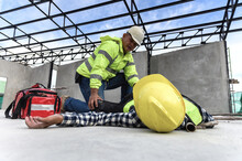 Heat Stroke Or Heat Exhaustion In Body While Outdoor Work. Accident At Work Of Builder Worker At Construction Site. Check Response, Lifesaving, And Rescue, First Aid Basic Concept.