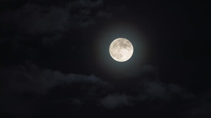 full bright moon with clouds. night view of full moon bright in the sky with clouds below
