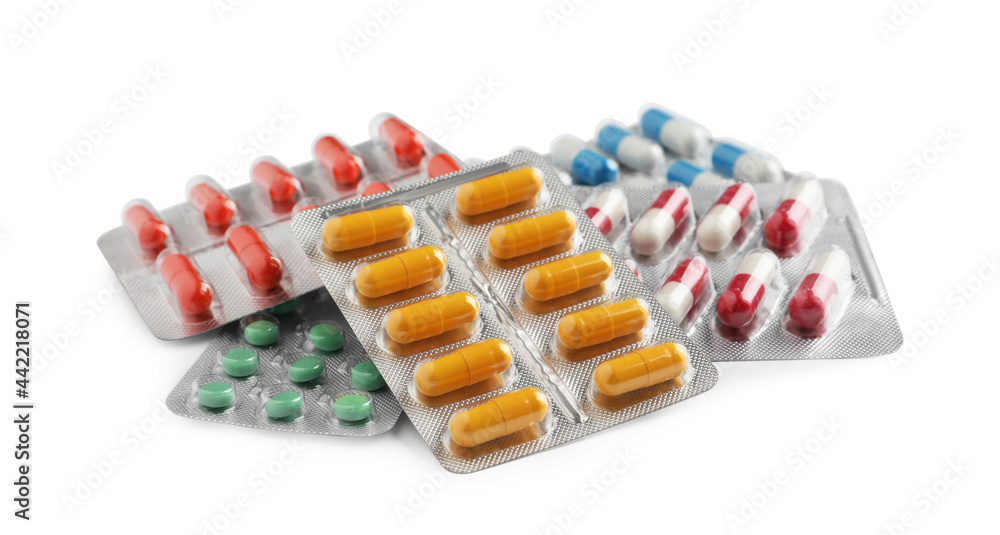 Pile of different pills in blister packs on white background - obrazy, fototapety, plakaty 
