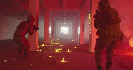 Wall Mural - Masked Team of Armed Modern Warfare Soldiers Team Move in Tactical Formation in a Dark Urban Battlefield Indoors.Soldiers Squad with Rifles and Flashlights in action.