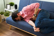 © AntonioDiaz - Latin man in agony due to a gastrointestinal virus