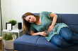 © AntonioDiaz - Sick woman in agony because of cramps