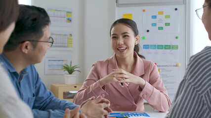 Small sme group asia young female leader people sale staff sit smile work share data plan idea on desk table in happy workplace workforce skill team from mentor coach training mba class at office.