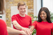 © zinkevych - Caucasian guy and dark-skinned girl showing togetherness sign