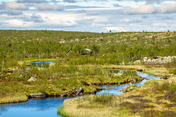 Sticker - Meandering river and a mountain hut in the north wilderness