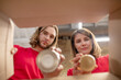 © zinkevych - Guy and girl putting canned food in box