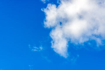 White fluffy clouds in the blue sky background.Cloudy white blue sky in the nice blue heaven sky.