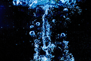 distribution of water black background.soft focus.