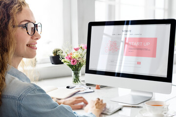 Wall Mural - Woman using computer